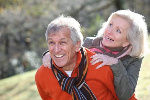 Senior couple having fun in countryside