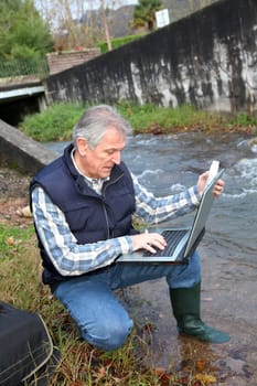 Hydrobiologist testing quality of water