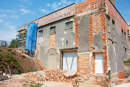 Reconstruction of a big house, scaffolding, bricks.