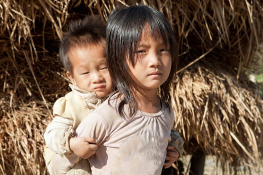 Asian children in poverty,sister of Laos with little brother