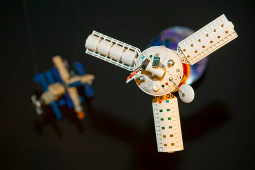 Model of space satellite taken as macro