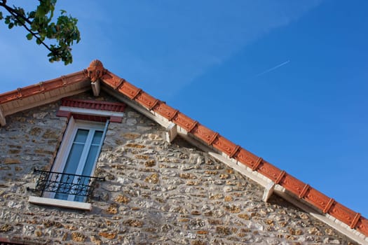 Close-up view of house&#039 roof in France with nice sky