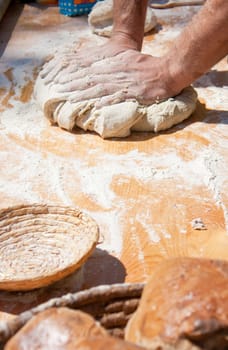 Baker kneading dough made with biological products