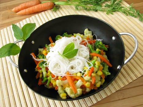 Vegetables with rice noodles and pineapple sage from the wok