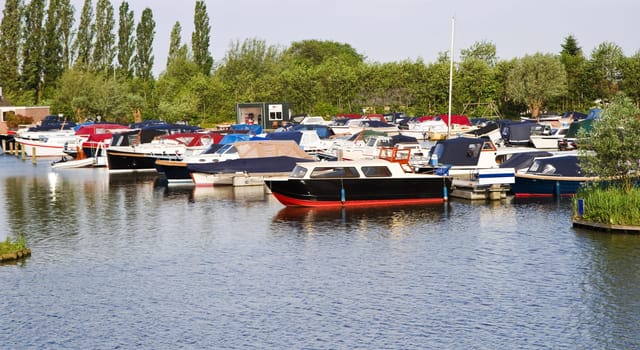Yachts in small marina on a beautiful sunny morning