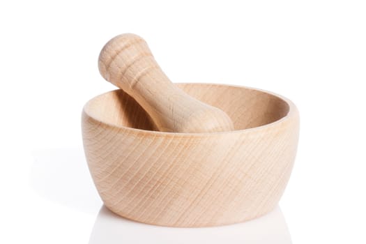 Wooden mortar with wooden pestle against white background