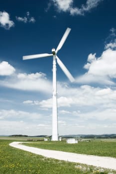Path in a meadow leading to the Wind Turbine