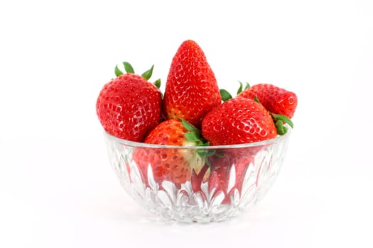 Fresh ripe strawberry in a glass bowl isolated on white background
