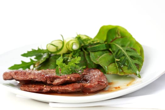 Beef steak with mixed green salad