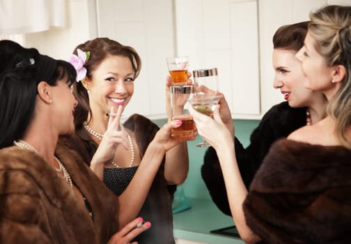 Group of four retro fashion housewives tell secrets in the kitchen