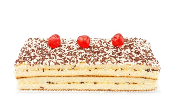 Freshly baked chocolate and coconut cake with cherries on top. Isolated over white background.