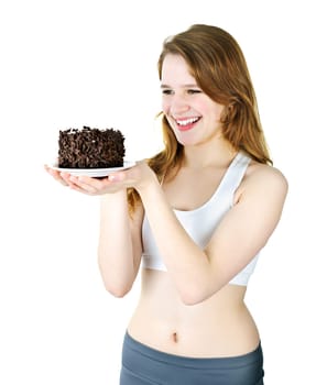 Smiling young woman holding a delicious chocolate cake