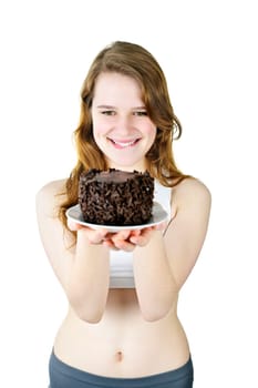 Smiling young woman tempted by a delicious chocolate cake