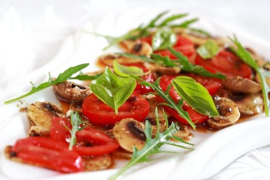Champignon Carpaccio with marinated tomato and rucola salad