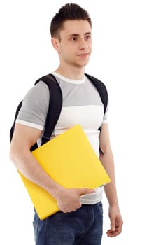 Young student with his notebook in hand, smiling and looking at somebody