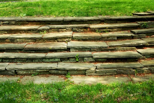 A Old stone stairway with grass
