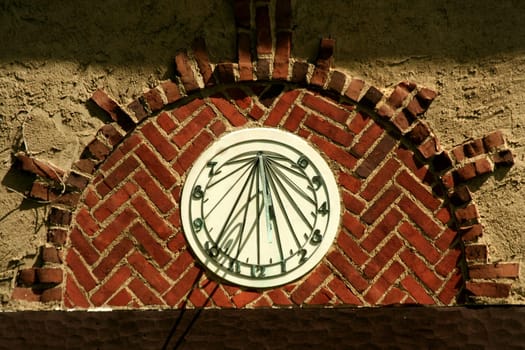 A Old sundial on a building