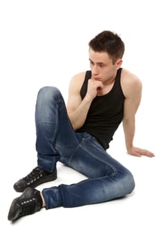 Young man thinking and hand resting on