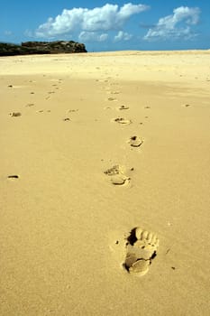Footprints around sand