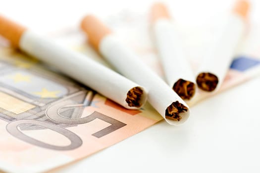 Cigarettes on five-euro bill (no pr)