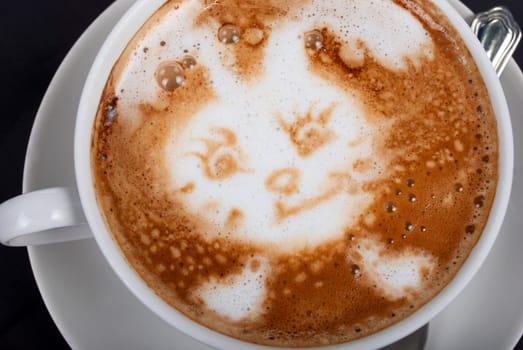 Cup of latte on a dark background