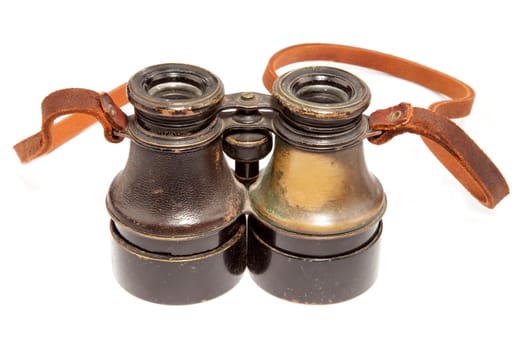 Antique binoculars on white background