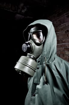 Bizarre portrait of man in gas mask