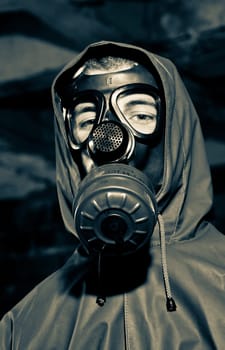 Bizarre portrait of man in gas mask