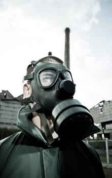 Bizarre portrait of man in gas mask