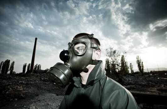 Bizarre portrait of man in gas mask