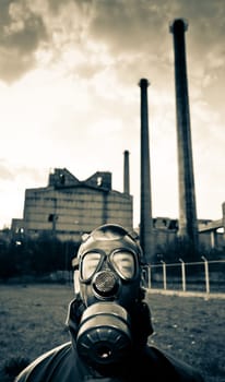 Bizarre portrait of man in gas mask