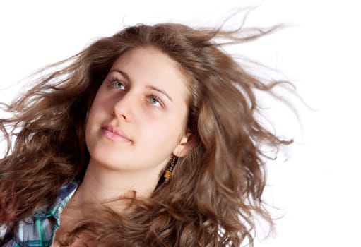 young brunette woman with long flying hair, studio shot
