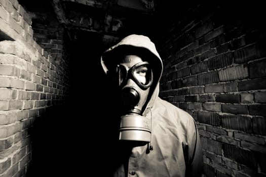 Bizarre portrait of man in gas mask
