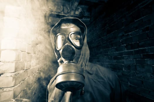 Bizarre portrait of man in gas mask