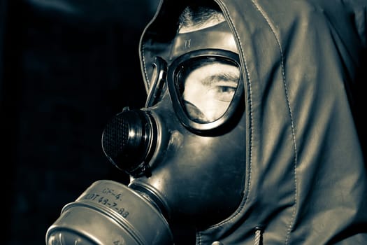 Bizarre portrait of man in gas mask