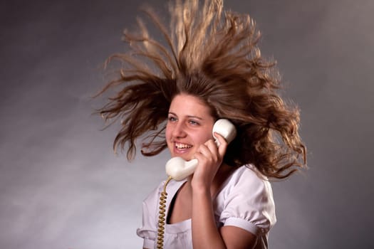 Mad woman shouting at old phone