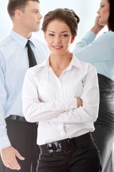 Businesswoman against two other businesspeople