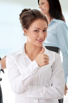 Business woman with thumbs up
