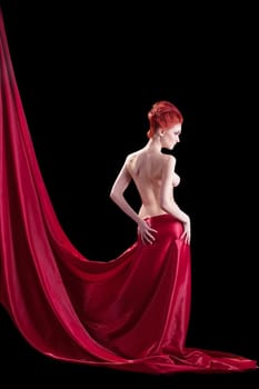 Beautyful young naked red woman in dark