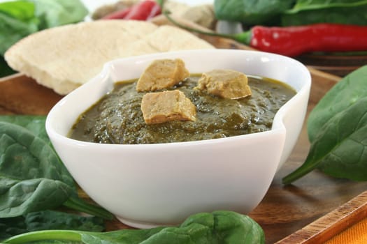 Indian palak paneer with rice and fresh ingredients
