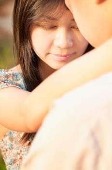 Loving Couple face to face at outdoor during sunset