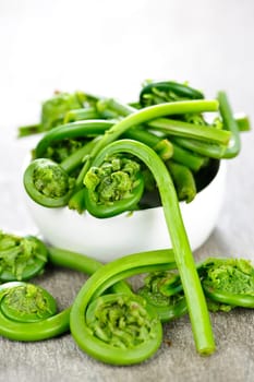 Fresh spring wild fiddleheads in a bowl