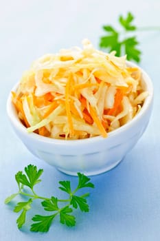 Bowl of fresh coleslaw with shredded cabbage