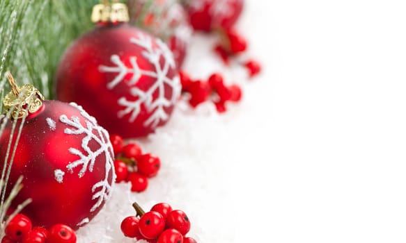 Red Christmas decorations with pine branches with copy space