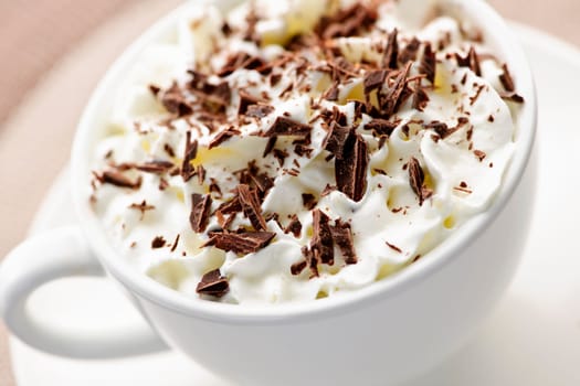 Hot cocoa with shaved chocolate and whipped cream