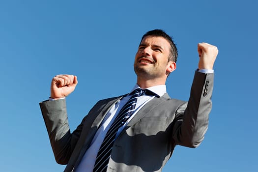 young businessman and blue sky in summer