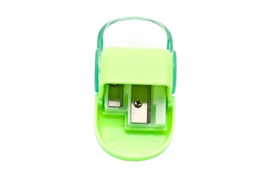 Green pencil sharpener isolated on white background