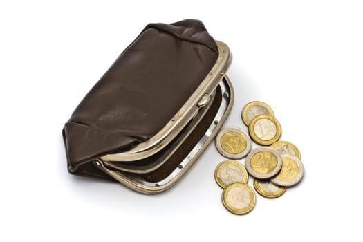 Old purse and euro coins closeup on white background