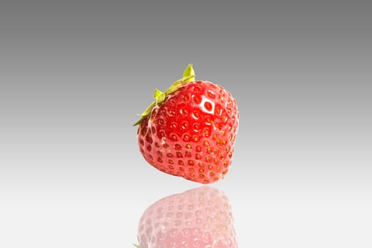Fresh strawberry closeup on light background
