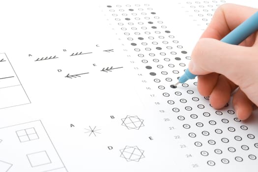 Hand filling IQ test - intelligence measuring concept